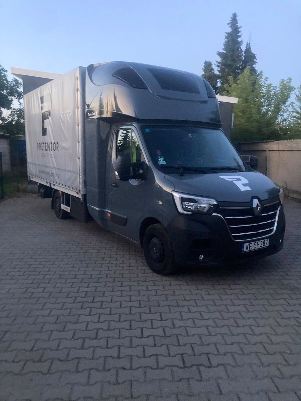 Branded Renault Master curtain-side van ready for departure